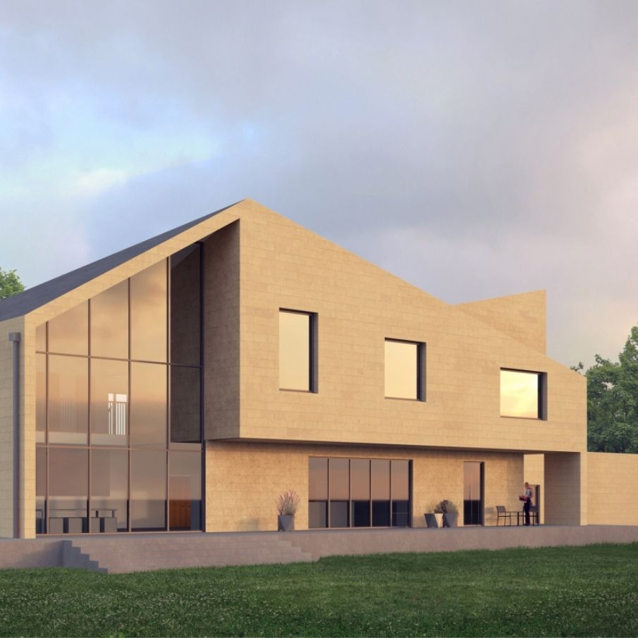 A building with a pointed roof and a large glass wall